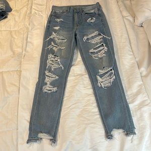 American Eagle. Size 2. boyfriend Jeans. light wash. Many rips up front and back